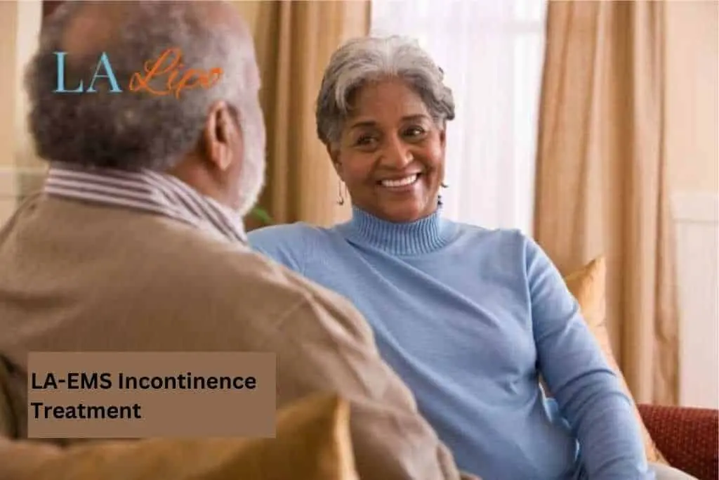 Couple sat smiling at each other - LA-EMS treatment West Sussex