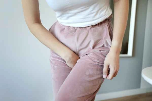 older woman running to the toilet because of urinary incontinence West Sussex