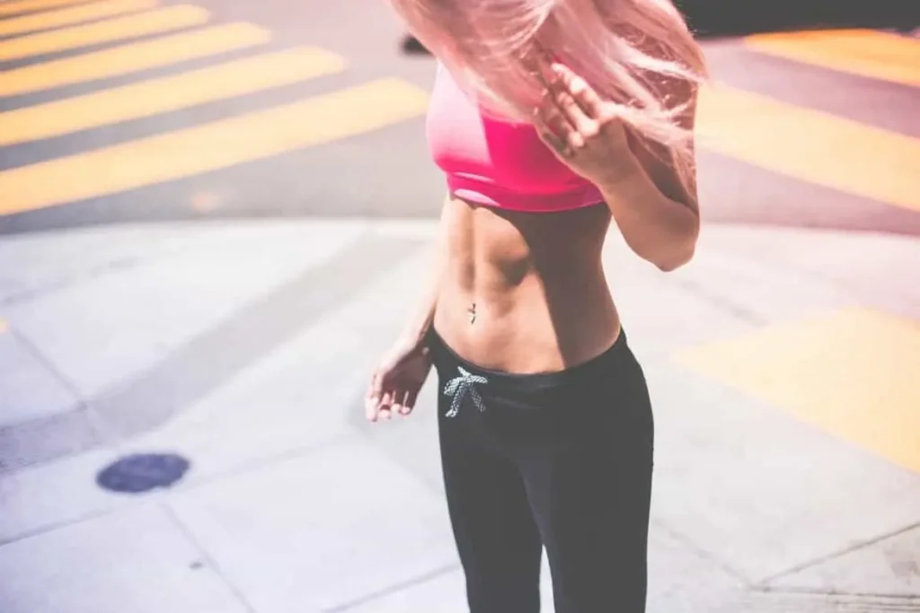 Woman with toned stomach after LA-EMS Body Sculpting Treatment West Sussex
